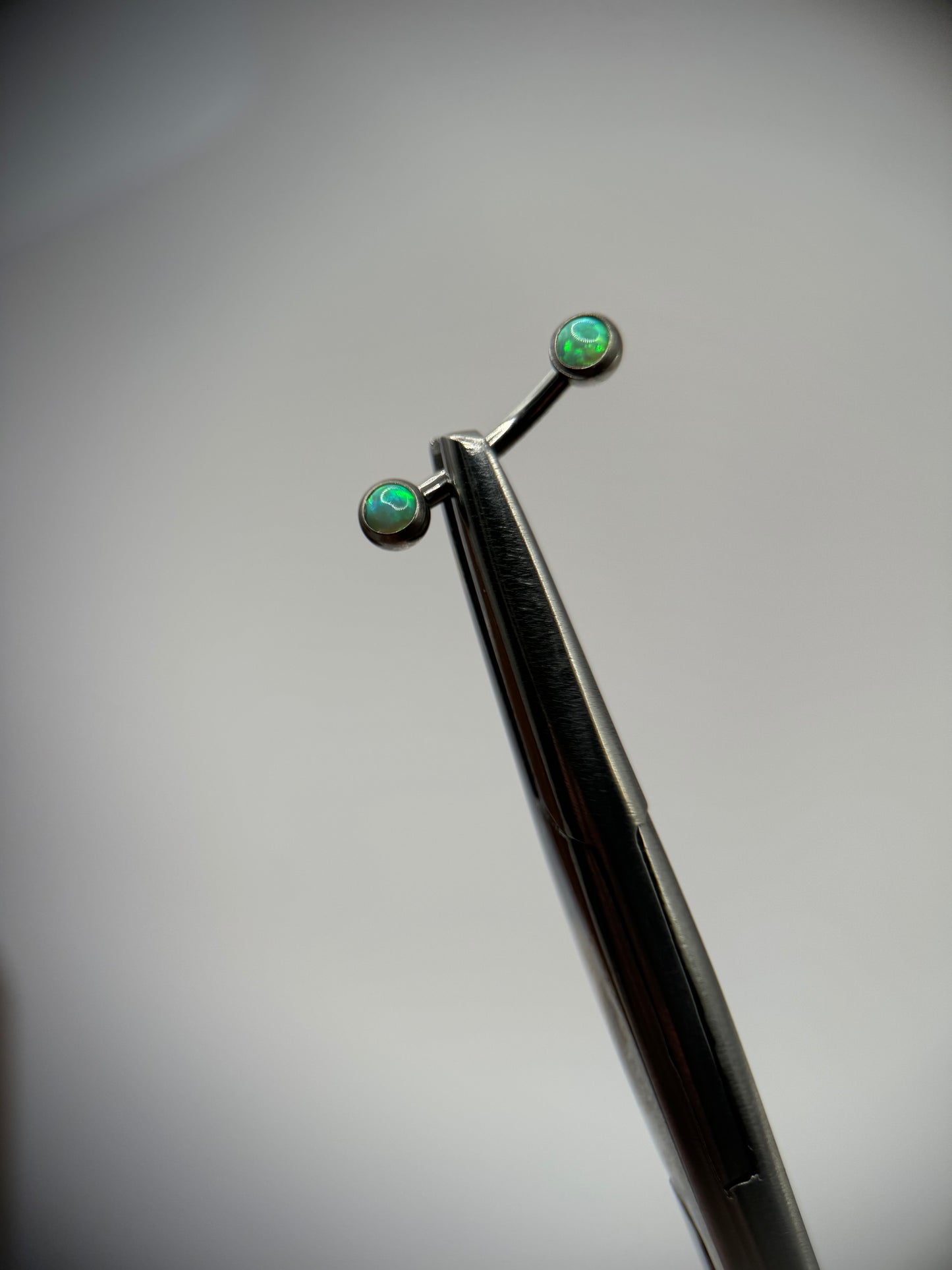 16g Double gem Lime Opal Ti. Curve Barbell